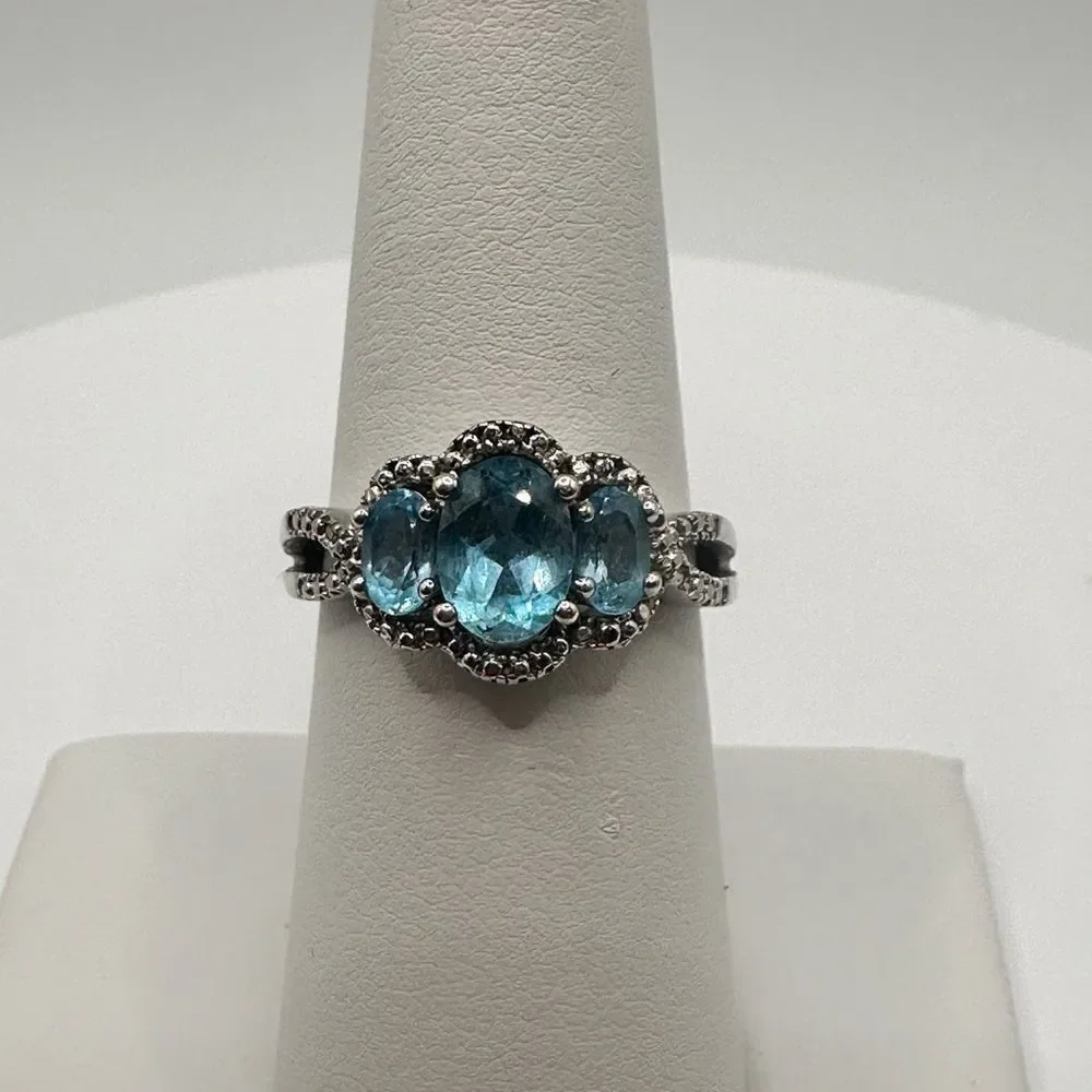 1.25ctw Swiss‎ blue topaz and genuine diamond accents in stamped .925 ring!!